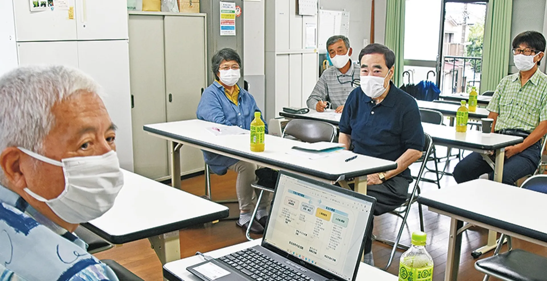 地区会館で開かれた受賞報告会
